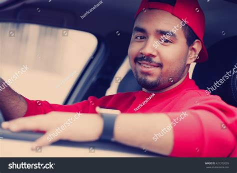 cheerful young black man driving car stock photo  shutterstock