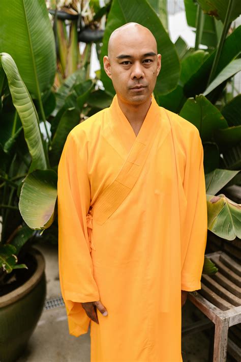 A Monk Walking Down the Stairs · Free Stock Photo