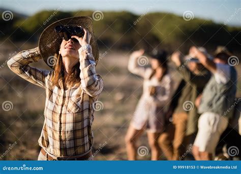 Beautiful Woman Looking through Binoculars during Safari Vacation Stock ...