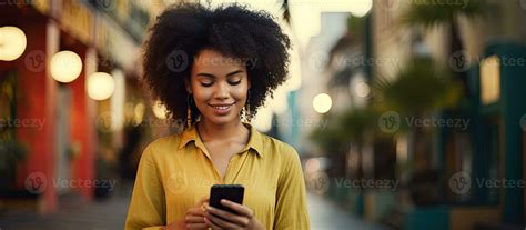 Latina woman with afro hair in a ponytail talking on phone with blank