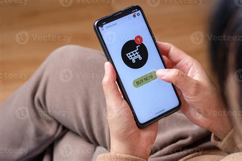 close up click buy now button on mobile shopping app 7919078 Stock