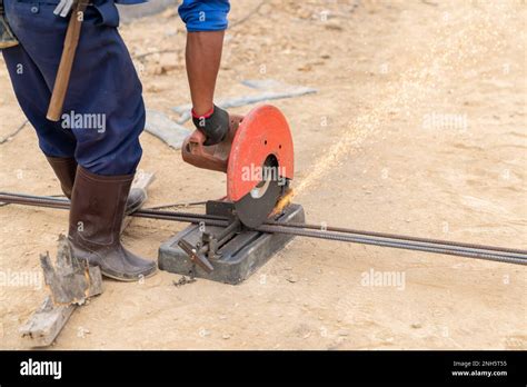 Worker cut steel bar with electric fiber cutting sparks fire while ...