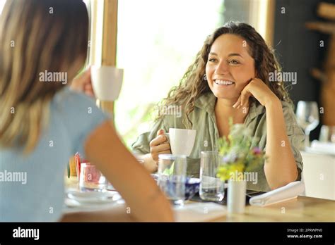 women talking drinking coffee   restaurant stock photo alamy