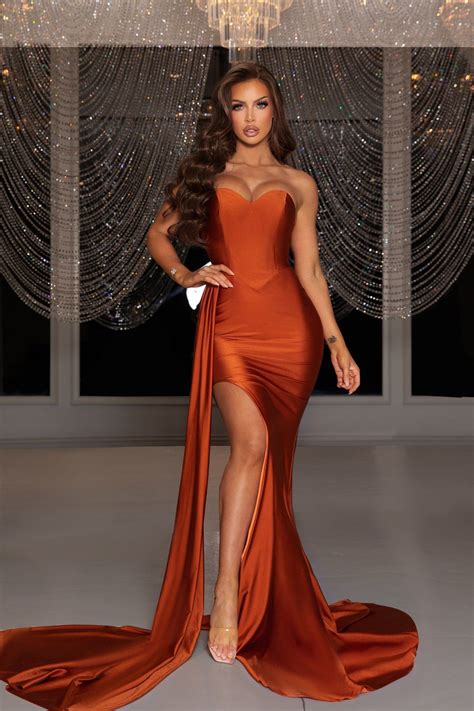Ciara is a glamour queen in a burnt orange gown at the dolce gabbana