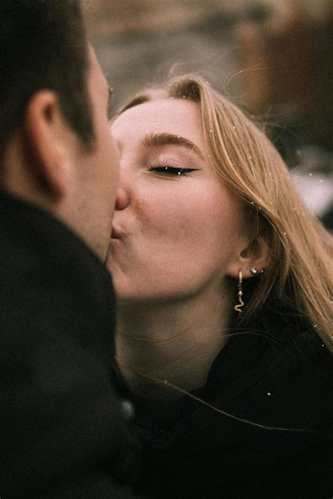 Girlfriend kissing Boyfriend on Cheek · Free Stock Photo