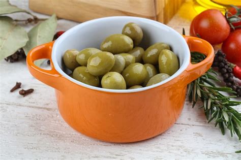 Premium Photo | Green olives in the bowl