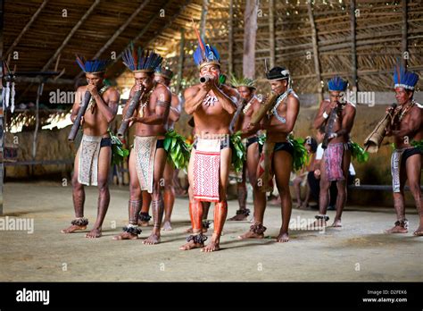 Indigenous people of the Amazon, perform their traditional music and ...