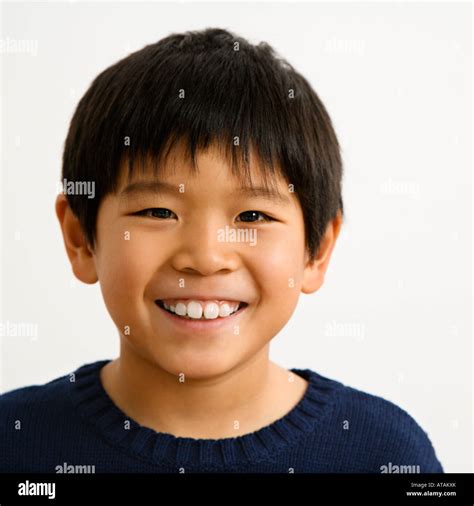 Portrait of young Asian boy smiling Stock Photo - Alamy