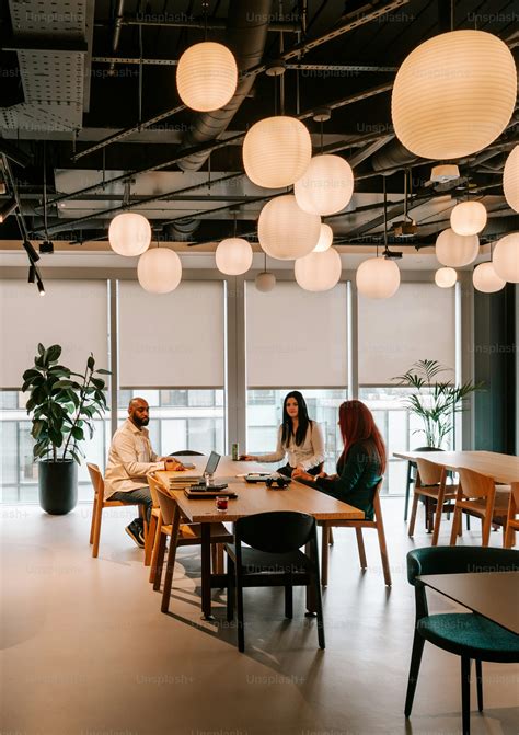 group  people sitting   table   room photo coworking