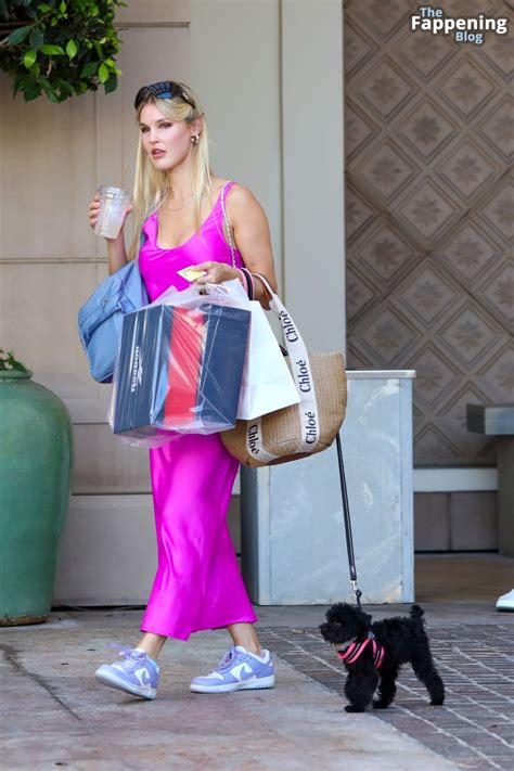 Braless Joy Corrigan Hugs Her Dog After a Shopping Spree in Beverly