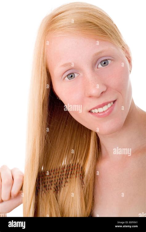 girl combing hair stock photo alamy
