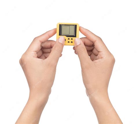 Premium Photo | Hand holding retro game electronic console isolated on