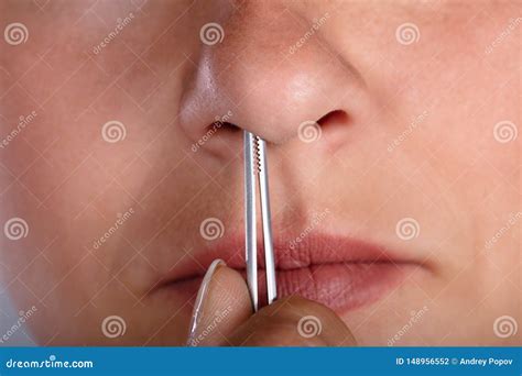 Woman Plucking Her Nose Hair Stock Photo - Image of pain, close: 148956552