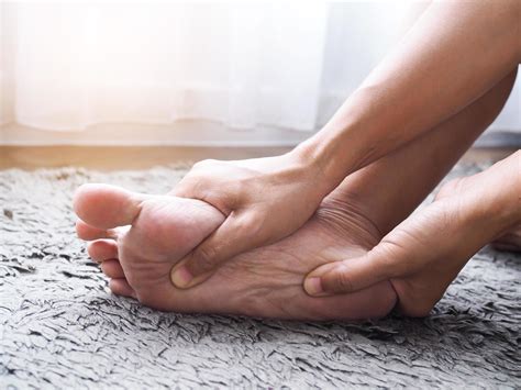 foot injury use hand massage on feet to relax muscle from heel pain