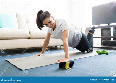 Woman Exercising Watching Online Videos Stock Photo - Image of female, online: 118957406