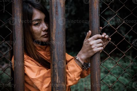 Prisoner in orange robe concept,Portrait of asian woman in Prison