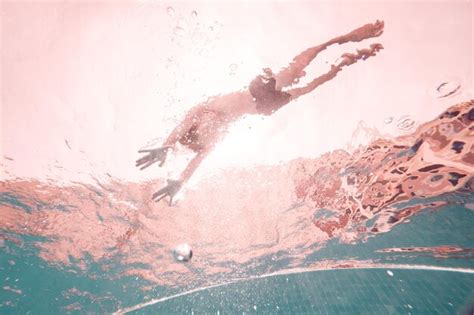 Premium Photo | From below full body underwater view of unrecognizable