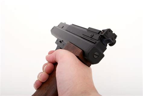 stock photo  person holding gun   images