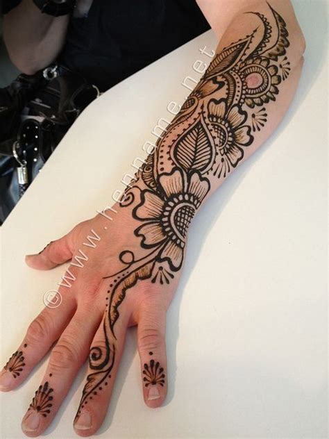 Henna flowers on arm | Henna tattoo designs simple, Henna tattoo ...