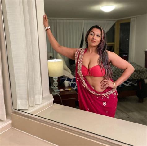 NRI Model Karima Essa Hot Cleavage in Red Saree Indian Actress Pics