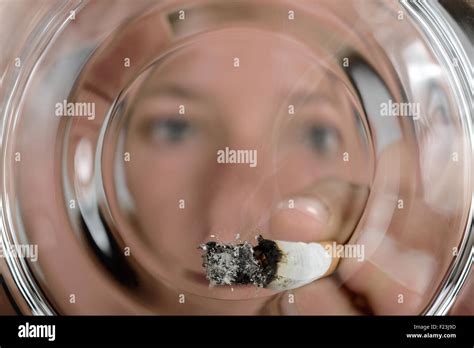 Person put out cigarette hi-res stock photography and images - Alamy