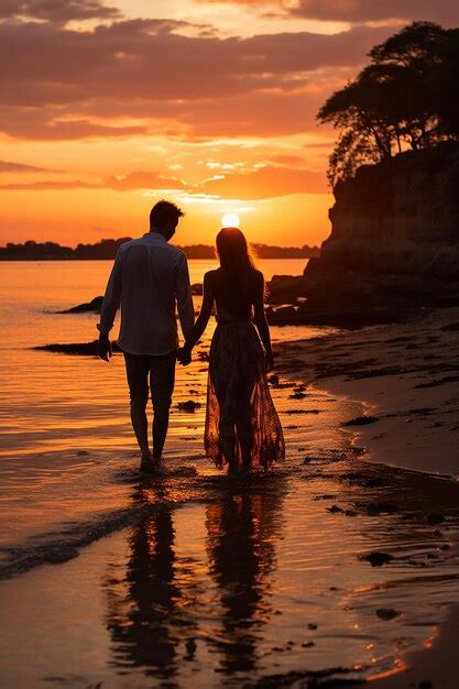 Premium AI Image | photo of sunset on the beach and lovers holding hands