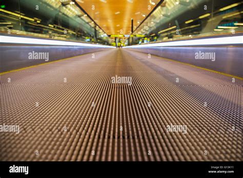 Close view of the moving walkway inside Stock Photo - Alamy