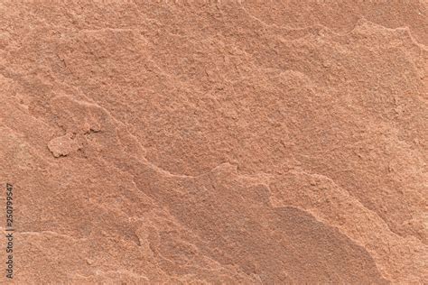 natural texture of red porous stone, close-up. Natural granite texture ...