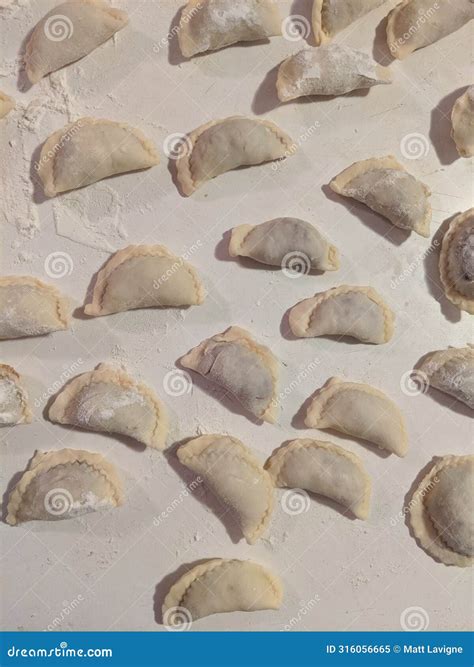Making homemade pierogies stock image. Image of eating - 316056665