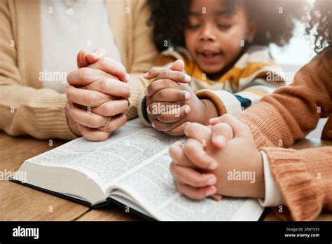 Bible, hands or mom praying with children siblings for prayer, support ...