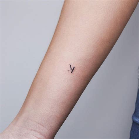 minimalistic letter  tattoo located