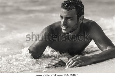 sexy handsome topless male model relaxing stock photo