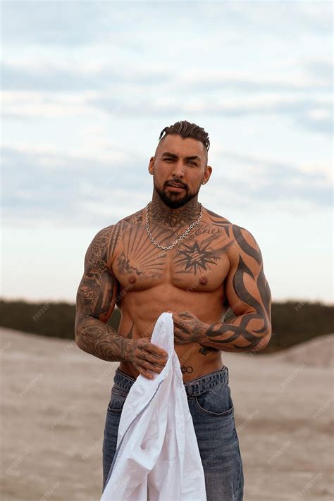 Premium Photo | Handsome young muscular italian man posing shirtless on