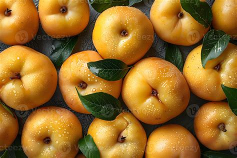 Fresh Juicy Persimmons with Water Droplets and Green Leaves - Ideal
