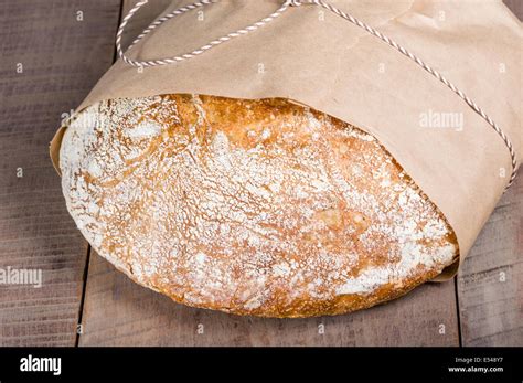 loaf  fresh baked bread wrapped  paper stock photo alamy