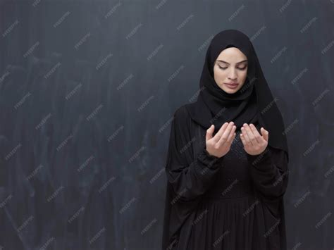premium photo portrait  young muslim woman making dua arabian girl