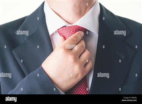 Adjusting tie hi-res stock photography and images - Alamy