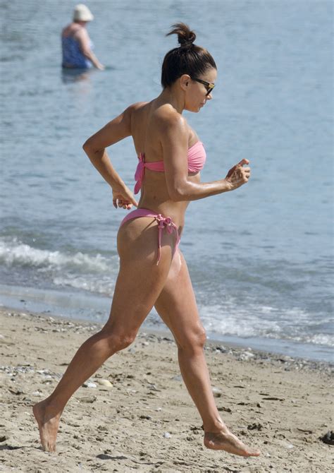 Eva Longoria, 48, shows off her fit figure in a pink bikini on the