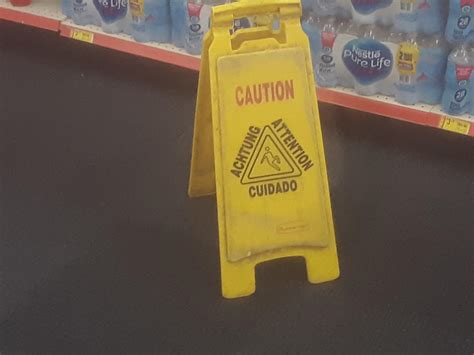 Wet floor sign on a carpet : r/facepalm