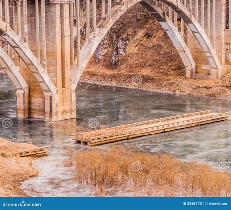 arch bridge  spandrel columns spanning  river stock image image