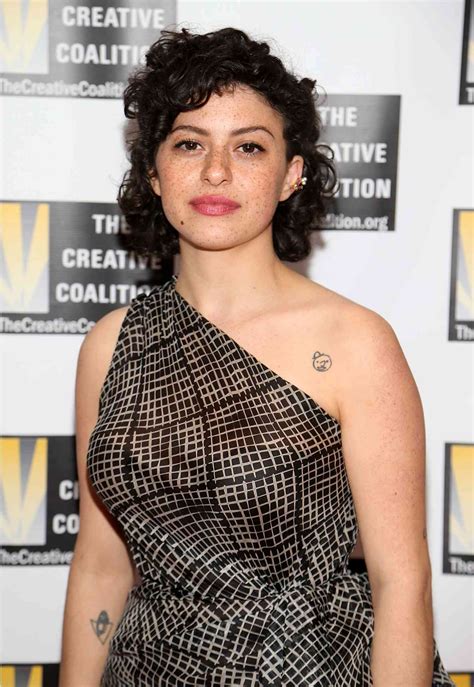 14 Curly Wolf Cut Ideas, According to Stylists