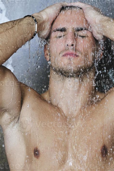 good looking man under man shower 10950679 Stock Photo at Vecteezy
