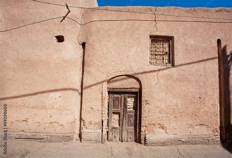 Door and closed window of an old clay house in Iran Stock Photo | Adobe ...