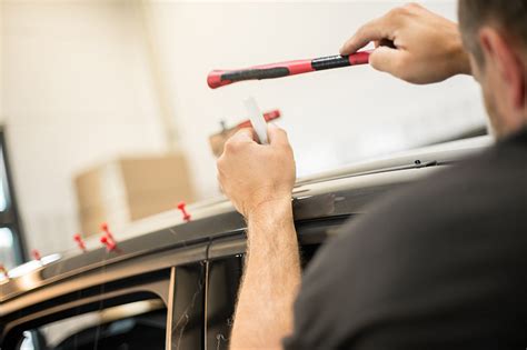 How Does Paintless Dent Repair Compare to DIY Kits?