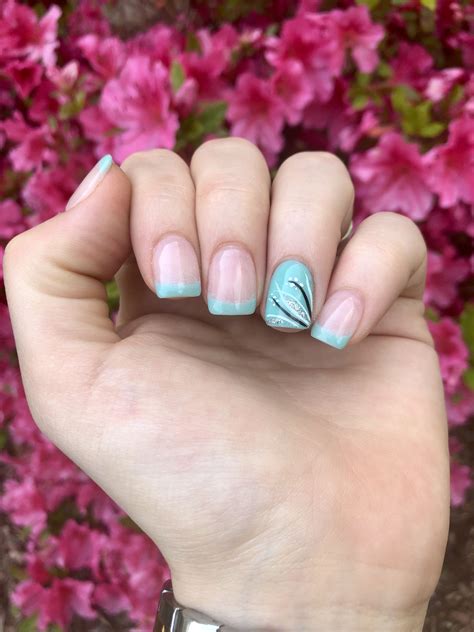 Summer nails! French manicure with teal tips and designed accent nail