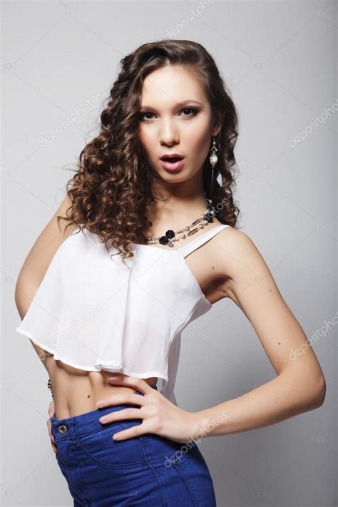Fashion model with curly hair Stock Photo by ©kanareva 63845329