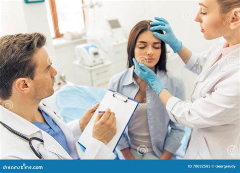woman   plastic surgeon stock photo image  examine beautician