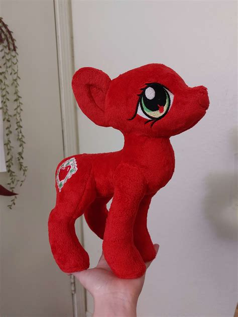 Working on a new plush, all she needs now is hair. Do you recognize