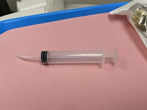 how to clean wisdom teeth holes with syringe