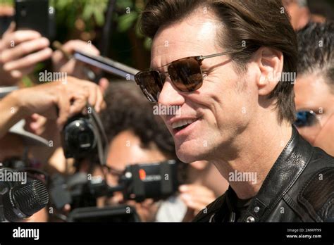 Actor Jim Carrey poses for photographers upon arrival at the press ...